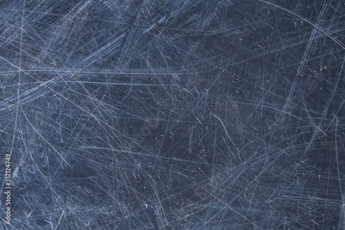 A close up abstract macro photo of a scratches and scraped grungey surface