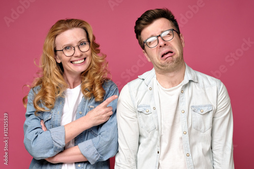 Fotografija Caucasian mature man laughing on problems of her coworker man