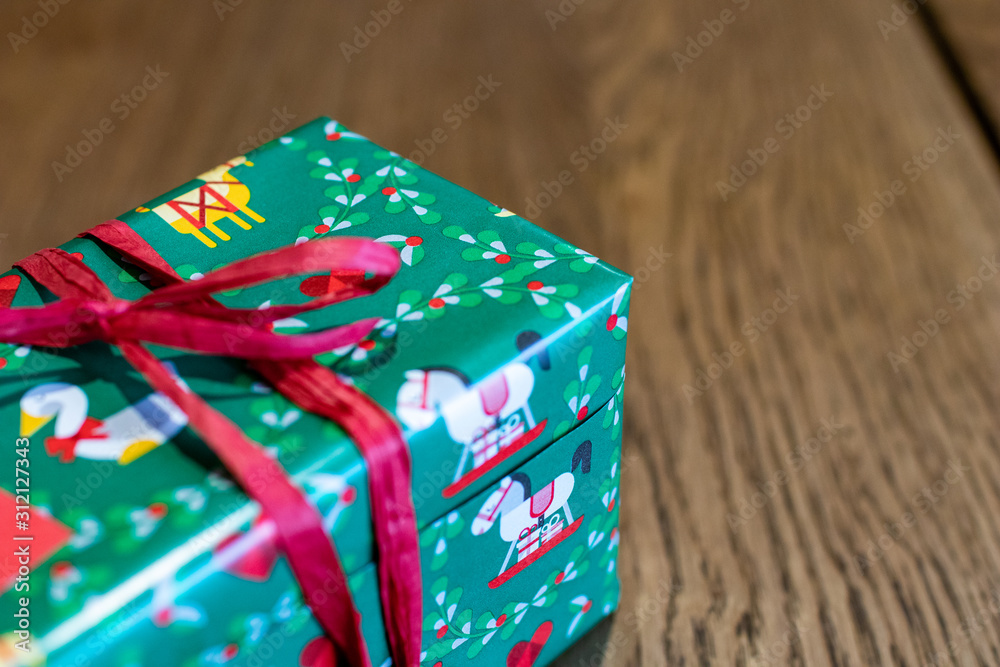 Christmas gift packages, wrapping gifts for the holiday season. make gifts in package with colored paper and bows on a work table