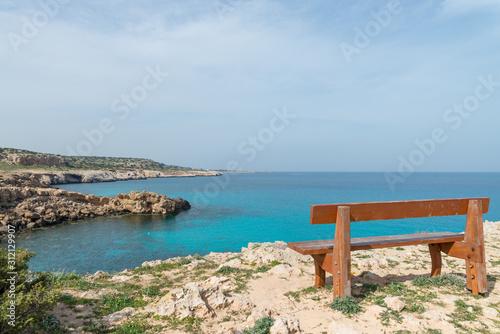 Wooden bench on the observation point at the small bay © Blue Cat Studio
