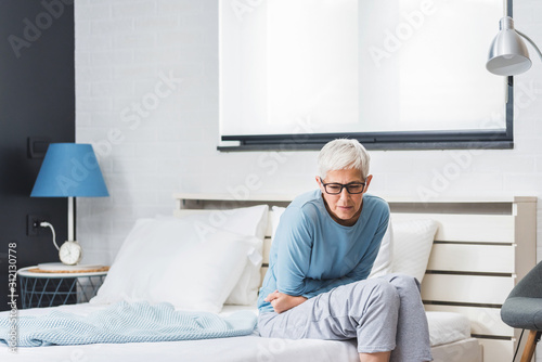 Senior woman suffering from pain at home
