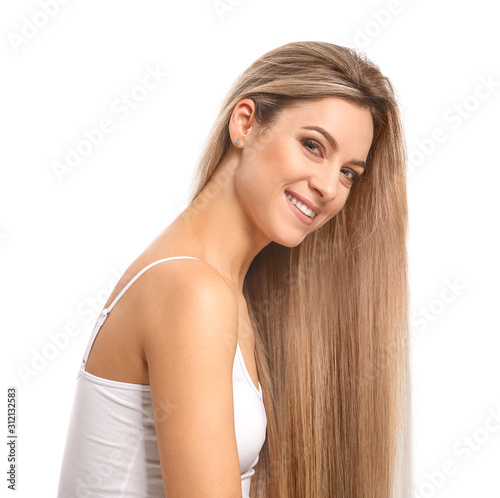 Beautiful young woman with healthy long hair on white background