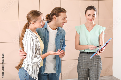Real estate agent showing y...