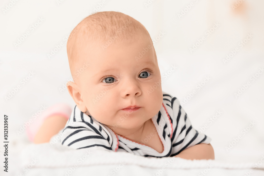 Portrait of cute little baby lying on bed Portrait of cute little baby lying on bed