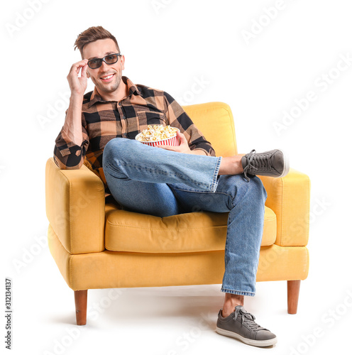 Handsome man watching movie...