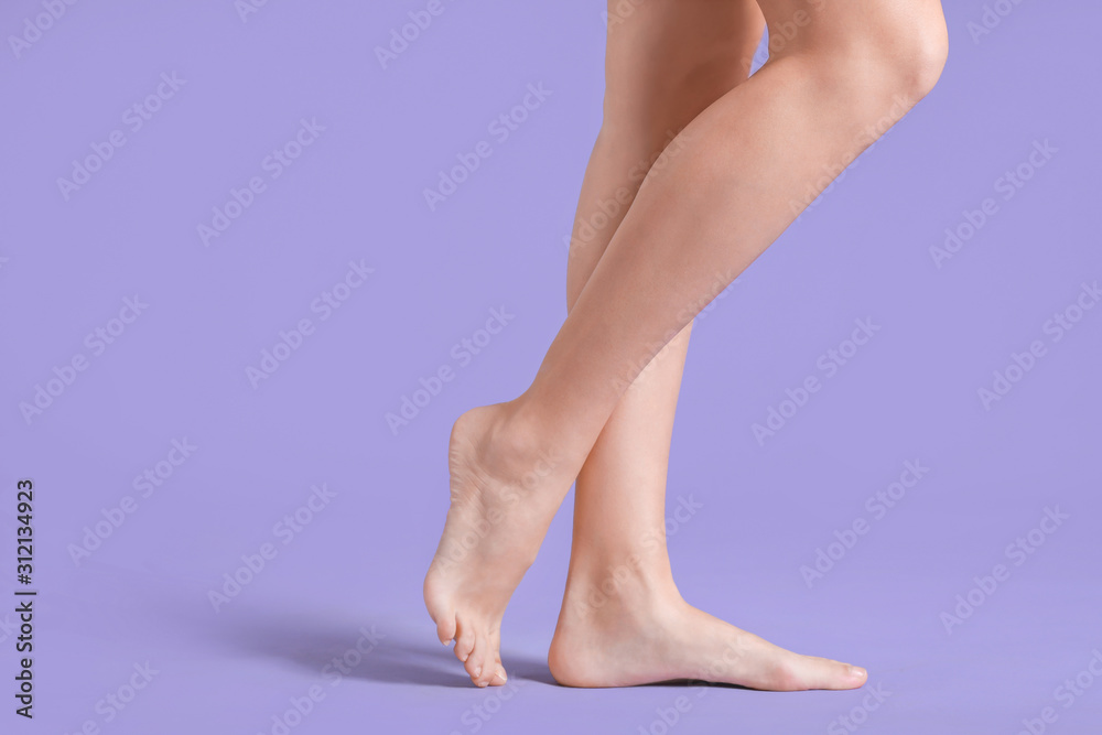 Legs of beautiful young woman on color background Legs of beautiful young woman on color background