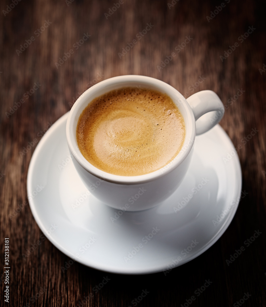Cup of coffee on rustic wooden background. Cup of coffee on rustic wooden background.