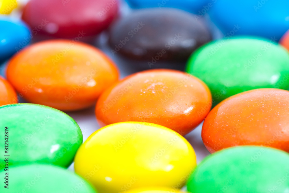 Close up - out of focus,A pile of colorful chocolate coated candy Close up - out of focus,A pile of colorful chocolate coated candy