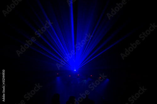 Abstract blue strobe lighting a concert