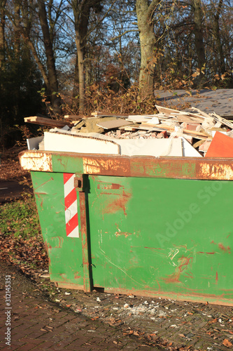 Loaded garbage dumpster