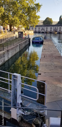 Boat entering the canal locks in Strasbourg  France
