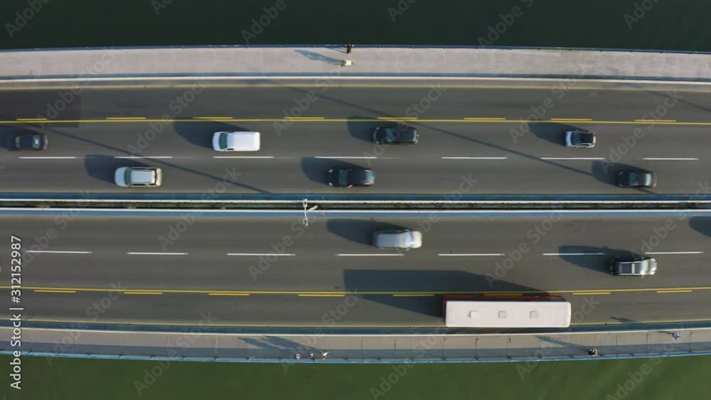 Top view of Bridge on Danube River in Serbia, car traffic filmed in 4k in Bird's eye view perspective. Amazing car above camera stable hovering. Top view of Bridge on Danube River in Serbia, car traffic filmed in 4k in Bird's eye view perspective. Amazing car above camera stable hovering.