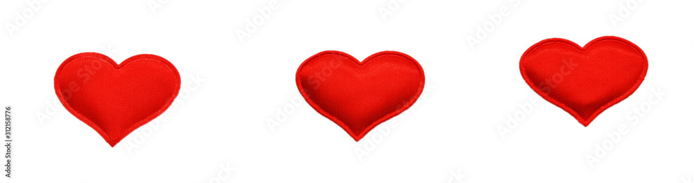 Red fabric hearts on an isolated background. Theme for Valentine's Day and holidays