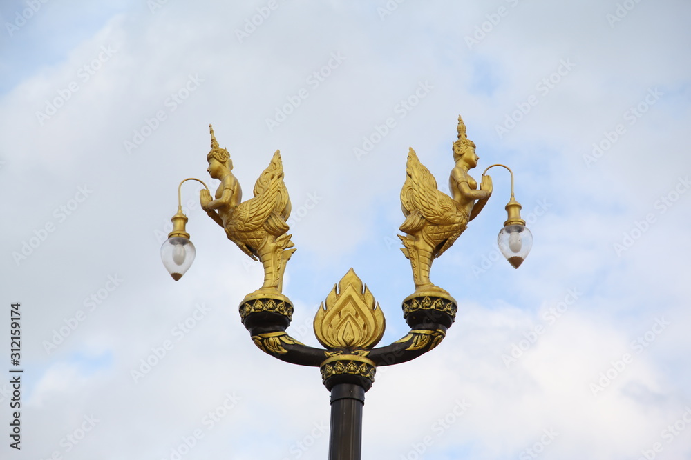 Golden bird lantern on the top of pole Golden bird lantern on the top of pole