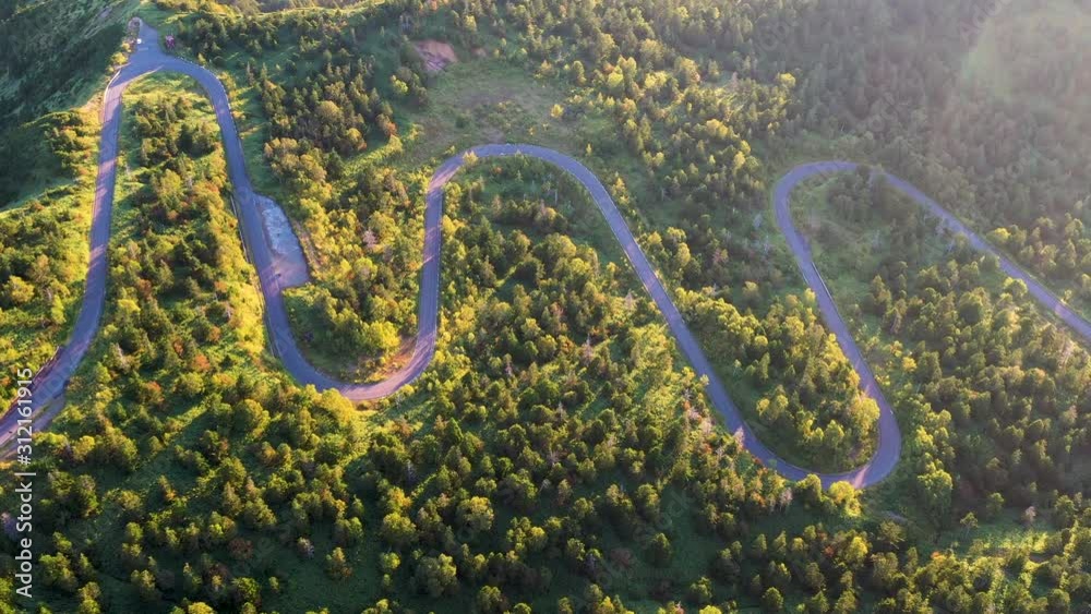 Aerial view of winding road on mountain in Autumn Aerial view of winding road on mountain in Autumn
