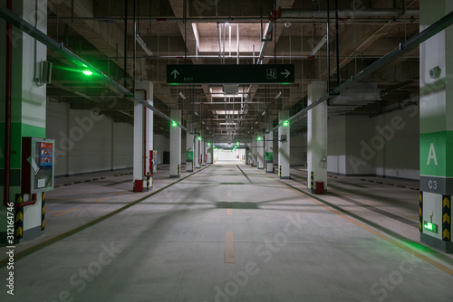 Perspective view of a large underground parking garage passage