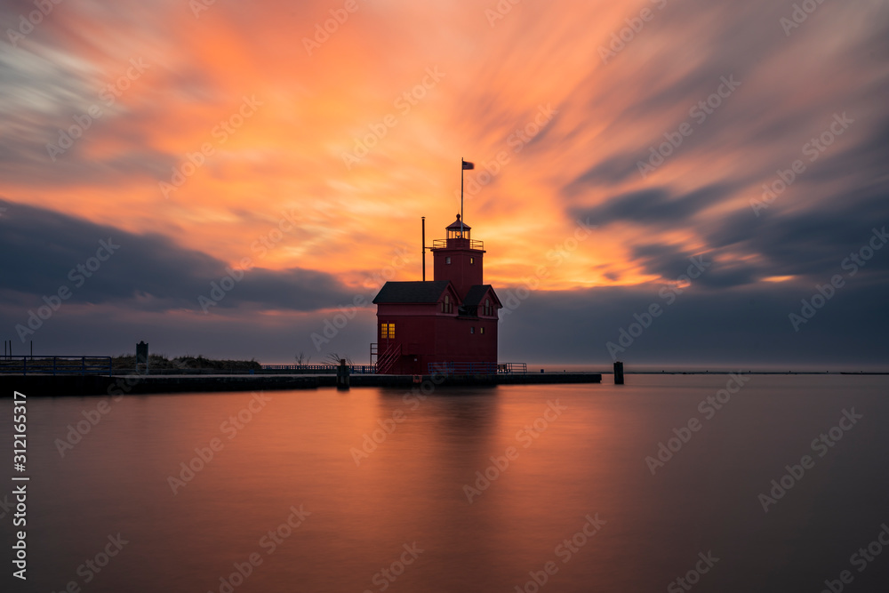 The Holland Harbor Lighthouse at the entrance of a channel connecting Lake Michigan and Lake Mactawa. Built in 1907, it is commonly referred to as The Holland Harbor Lighthouse at the entrance of a channel connecting Lake Michigan and Lake Mactawa. Built in 1907, it is commonly referred to as