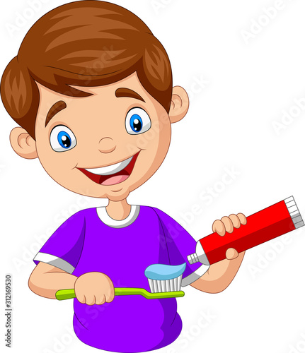 Cute little boy squeezing toothpaste on a toothbrush