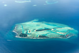 Aerial View of Maldives Island Beautiful blue sea with clouds and atolls famous tourist destination in the world
