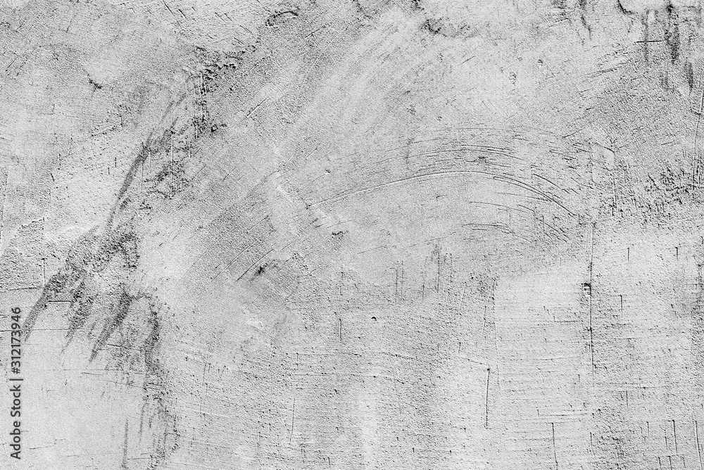Fototapeta premium Texture of a concrete wall with cracks and scratches which can be used as a background