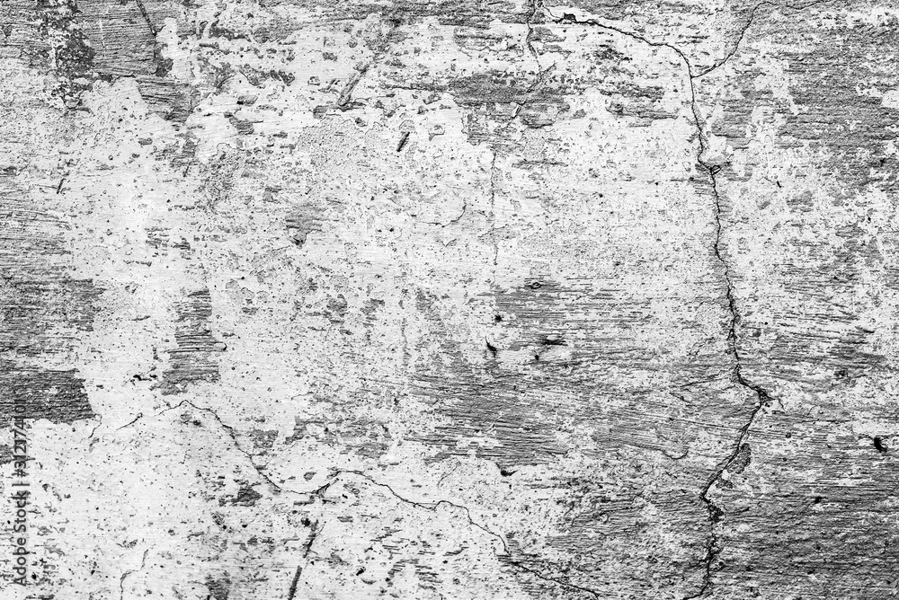 Texture of a concrete wall with cracks and scratches which can be used as a background Texture of a concrete wall with cracks and scratches which can be used as a background