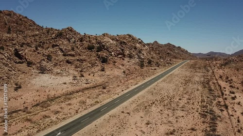 4K aerial drone video of gravel plains and granite rock formations near town Karasburg, B1 highway in the south of Namibia and dry waterless hot bush savanna in Grunau District, southern Africa photo