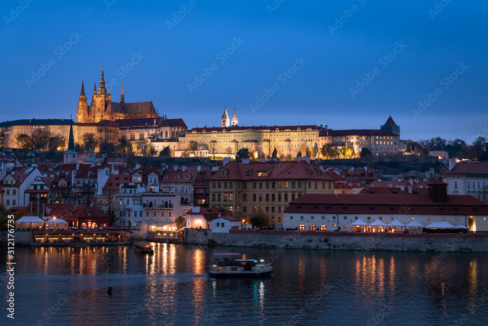 River Vltava and castle of Prague in the evening in autumn