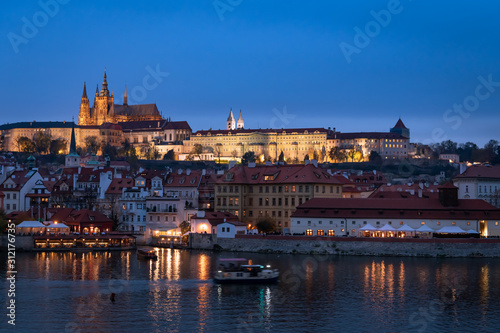 River Vltava and castle of Prague in the evening in autumn