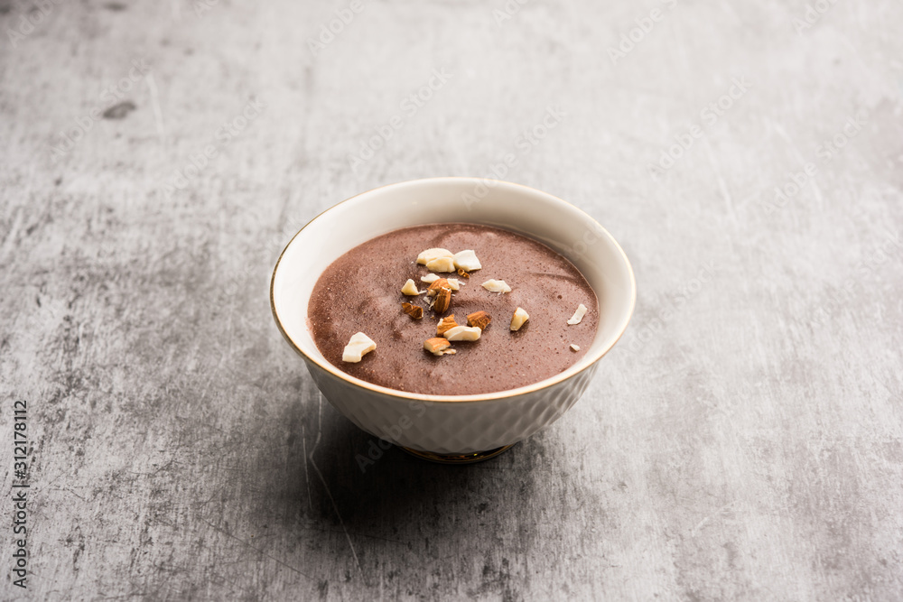 Sweet Ragi Malt / Healthy Ragi Porridge in a bowl garnished with crushed dry fruits Sweet Ragi Malt / Healthy Ragi Porridge in a bowl garnished with crushed dry fruits
