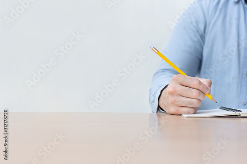 high school,university student study.hands holding pencil writing paper answer sheet.sitting lecture chair taking final exam 