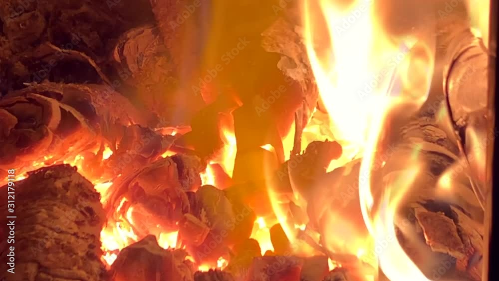 Slow motion video of firewood burning in a rustic stove. Beautiful bonfire in the fireplace. Tongues of flame and wood. Slow motion video of firewood burning in a rustic stove. Beautiful bonfire in the fireplace. Tongues of flame and wood.