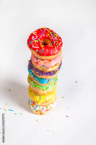 colorful doughnuts tower white background studio