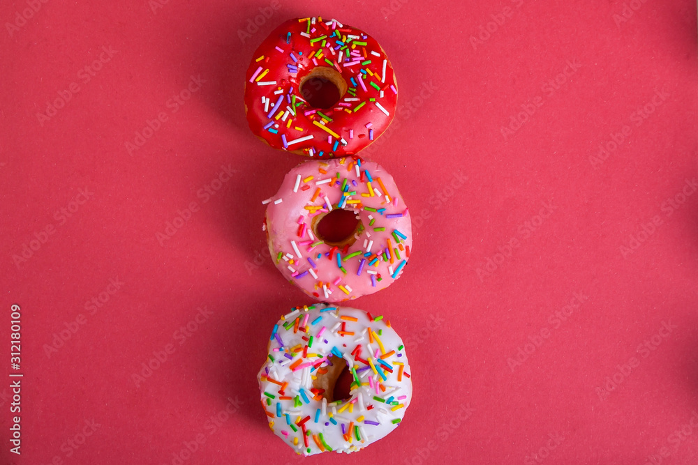 colorful doughnuts red background studio colorful doughnuts red background studio