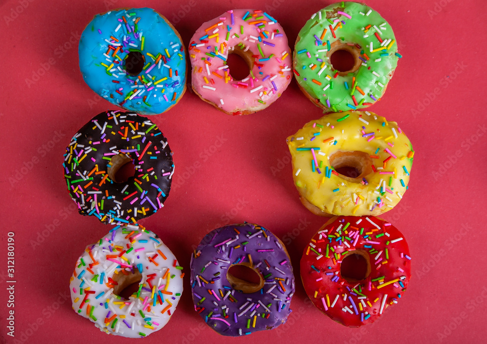 colorful doughnuts red background studio