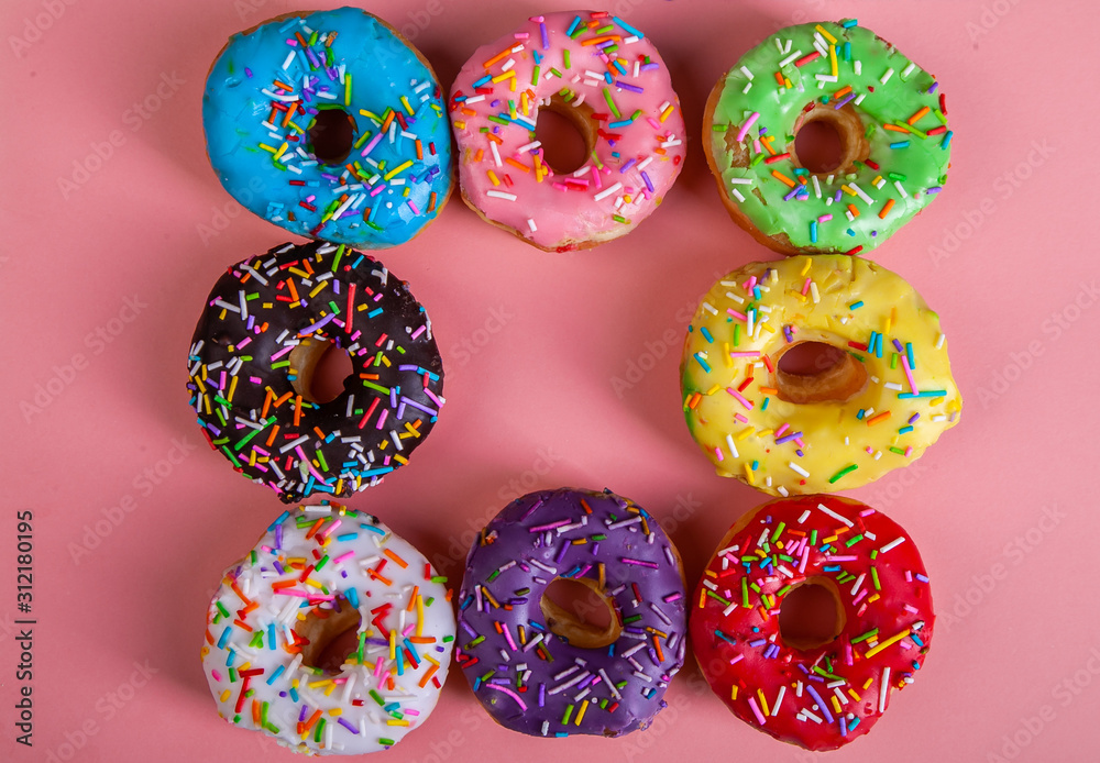 colorful doughnuts pink background studio