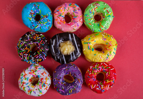 colorful doughnuts red background studio