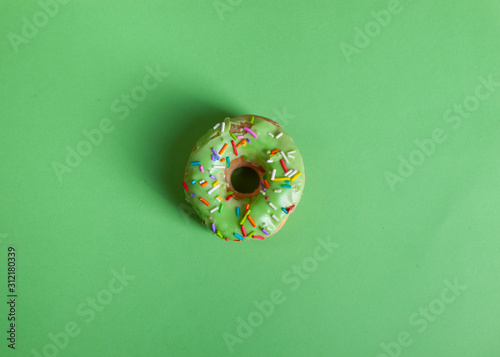 colorful doughnut green background studio