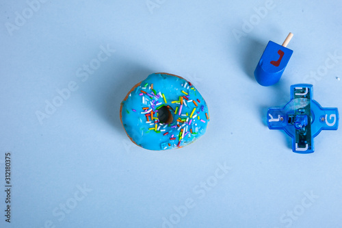 colorful doughnut dreidel blue background studio