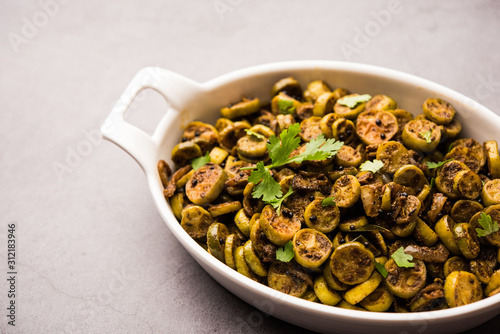 Tendli / Kundroo sabzi or Kovakkai Poriyal also known as ivy gourd, served in a bowl or karahi. selective focus