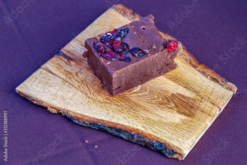Homemade chocolate placed on a wooden stand photo