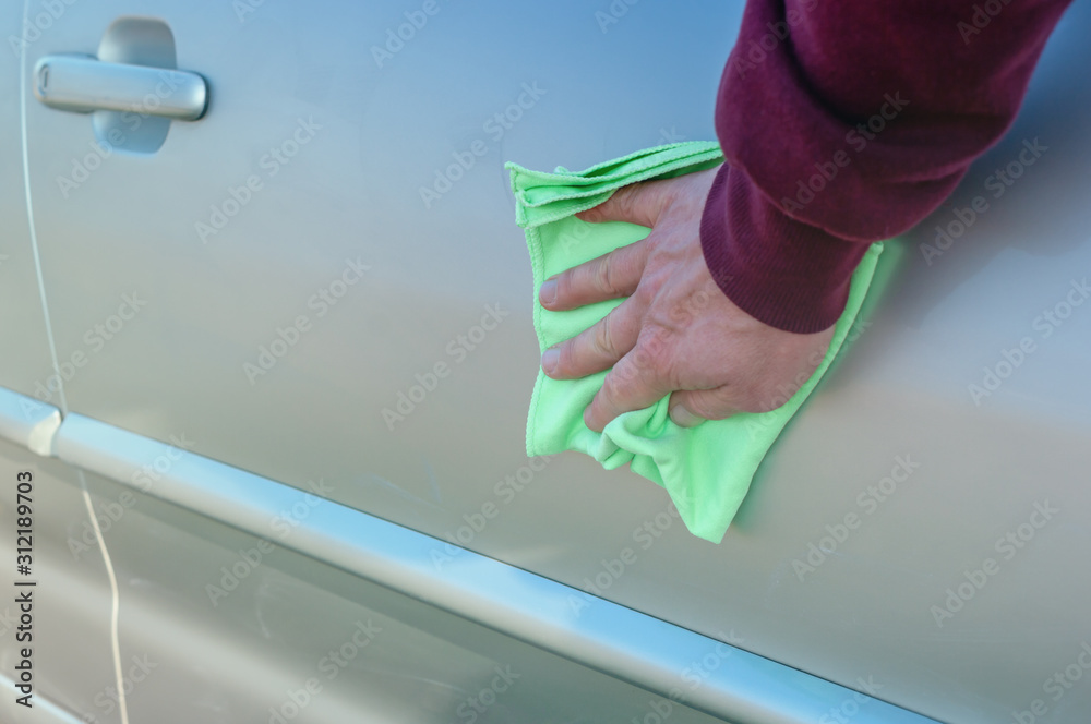 Car body polish with microfiber cloth.