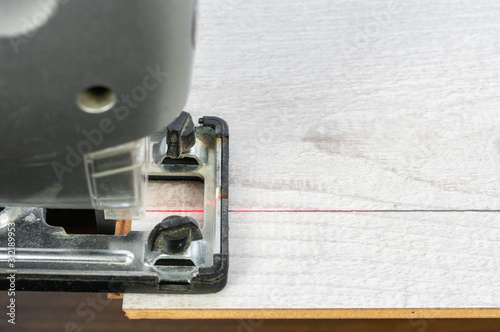 Obraz na płótnie Wood cut with electric jigsaw . w salonie
