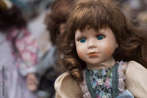 Closeup of vintage dolls at flea market in the street