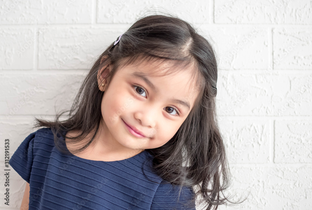 Fashion model and beauty look. Stylish girl with pretty face on grey background. Hairdresser, skincare, casual style. Beauty and kid fashion with healthy hair. Little girl with long hair. Fashion model and beauty look. Stylish girl with pretty face on grey background. Hairdresser, skincare, casual style. Beauty and kid fashion with healthy hair. Little girl with long hair.