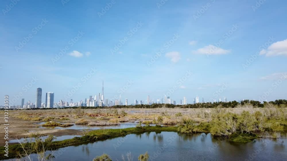 Dubai Ras al Khor Wildlife sanctuary timelapse over the city Dubai Ras al Khor Wildlife sanctuary timelapse over the city