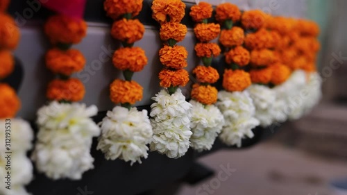 Traditional indian wedding ceremony: decorative car in flower for bridal and groom 