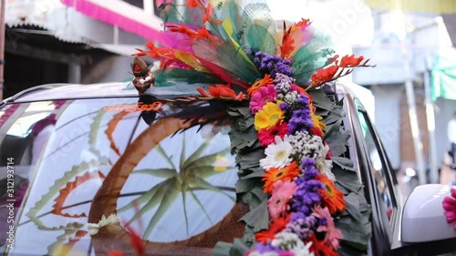 Traditional indian wedding ceremony: decorative car in flower for bridal and groom 