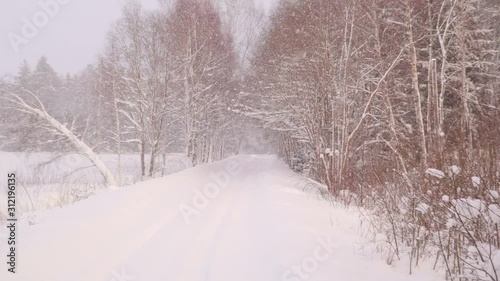 The closer look of th eroad filled with snow photo