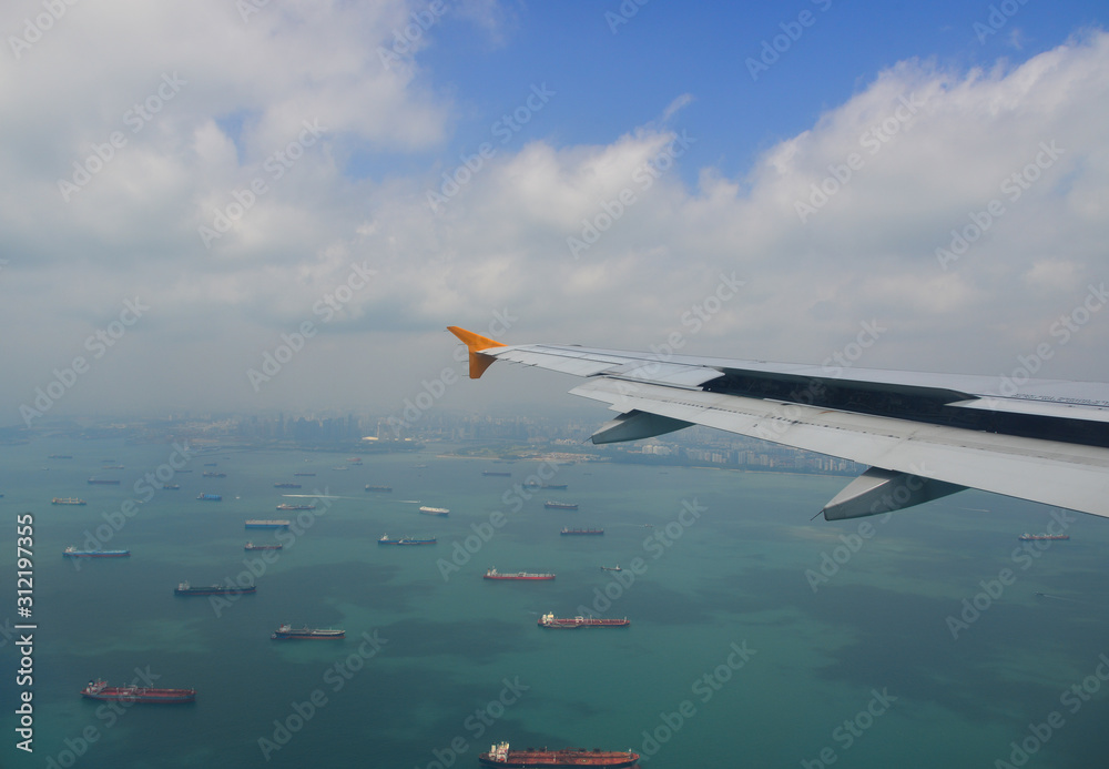 Airplane flying over the Singapore sea