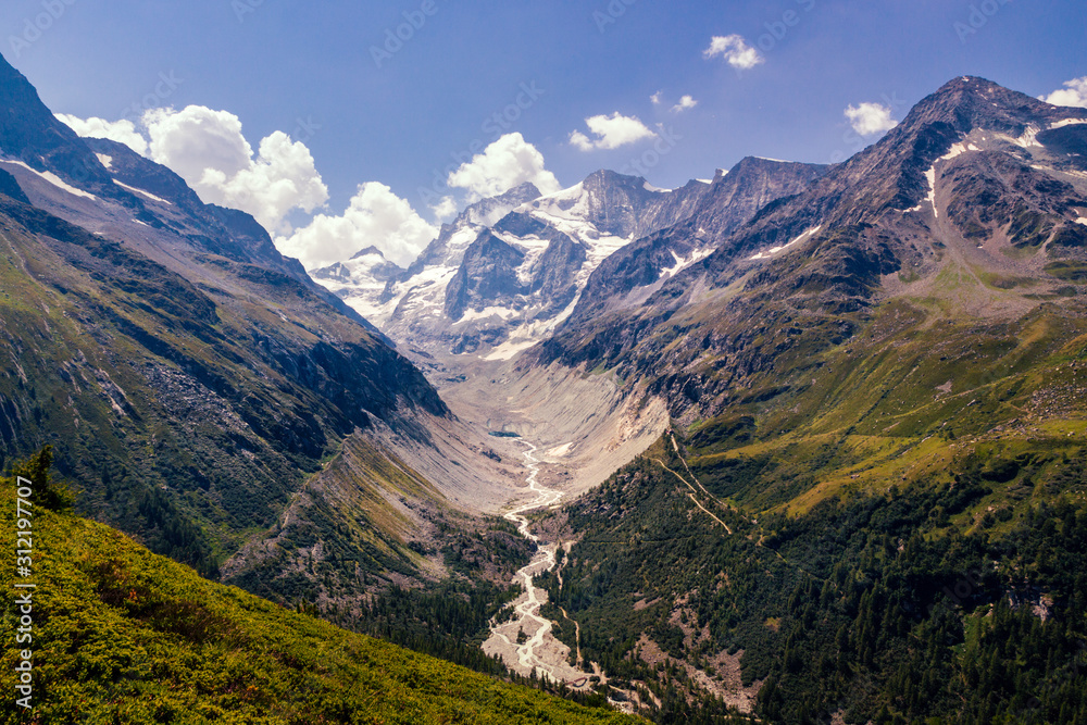 Scenic view on some high peaks of the Pennine alps near Val 'd Anniviers and glaciers running down to the valley in summer